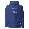 We Love Because He First Loved Us Hoodie - Brush White Text